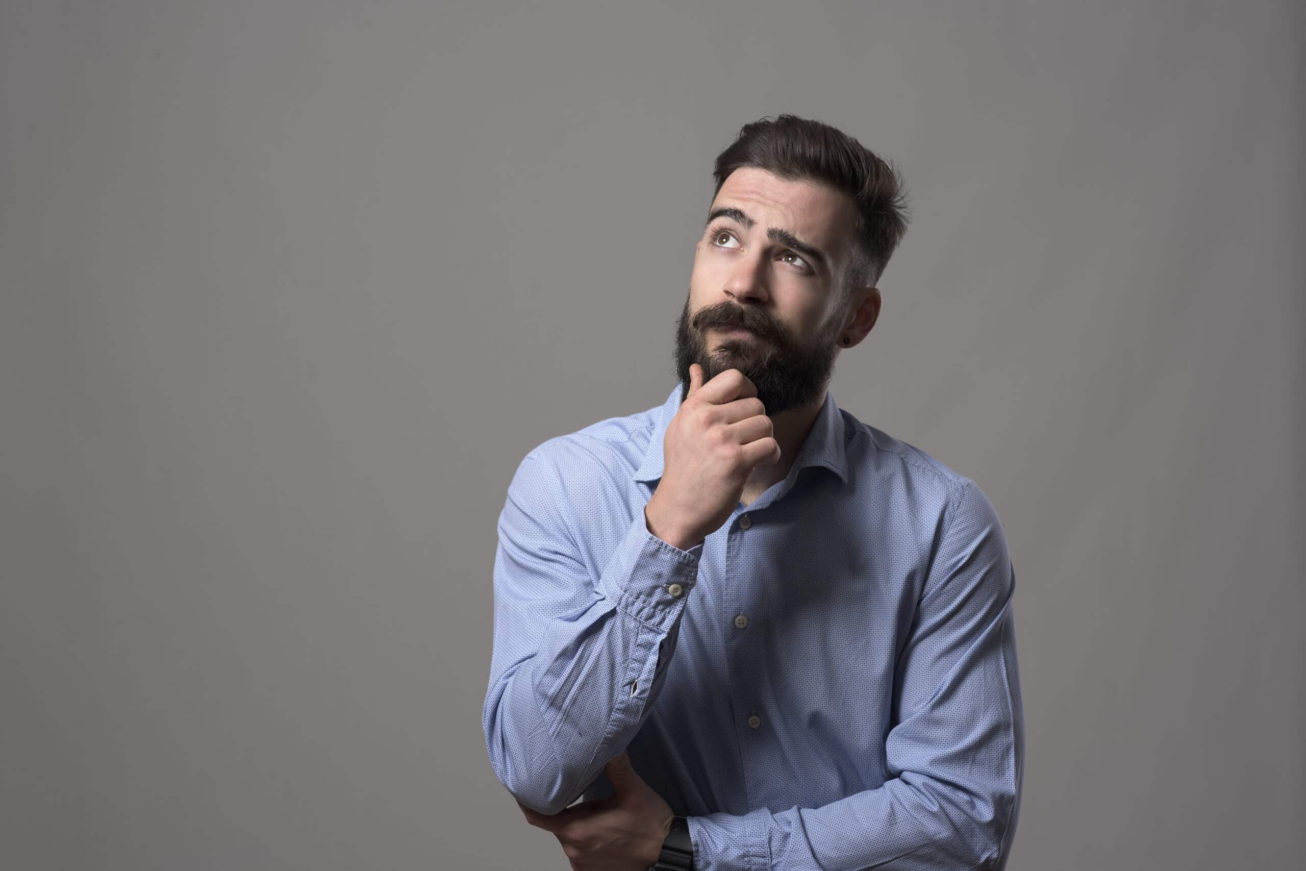 Man thinking with grey background