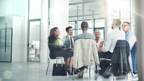 team surrounding table