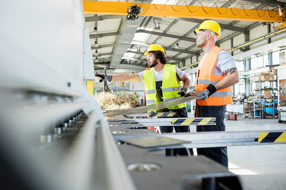 workers wearing hard hats and reflective vests