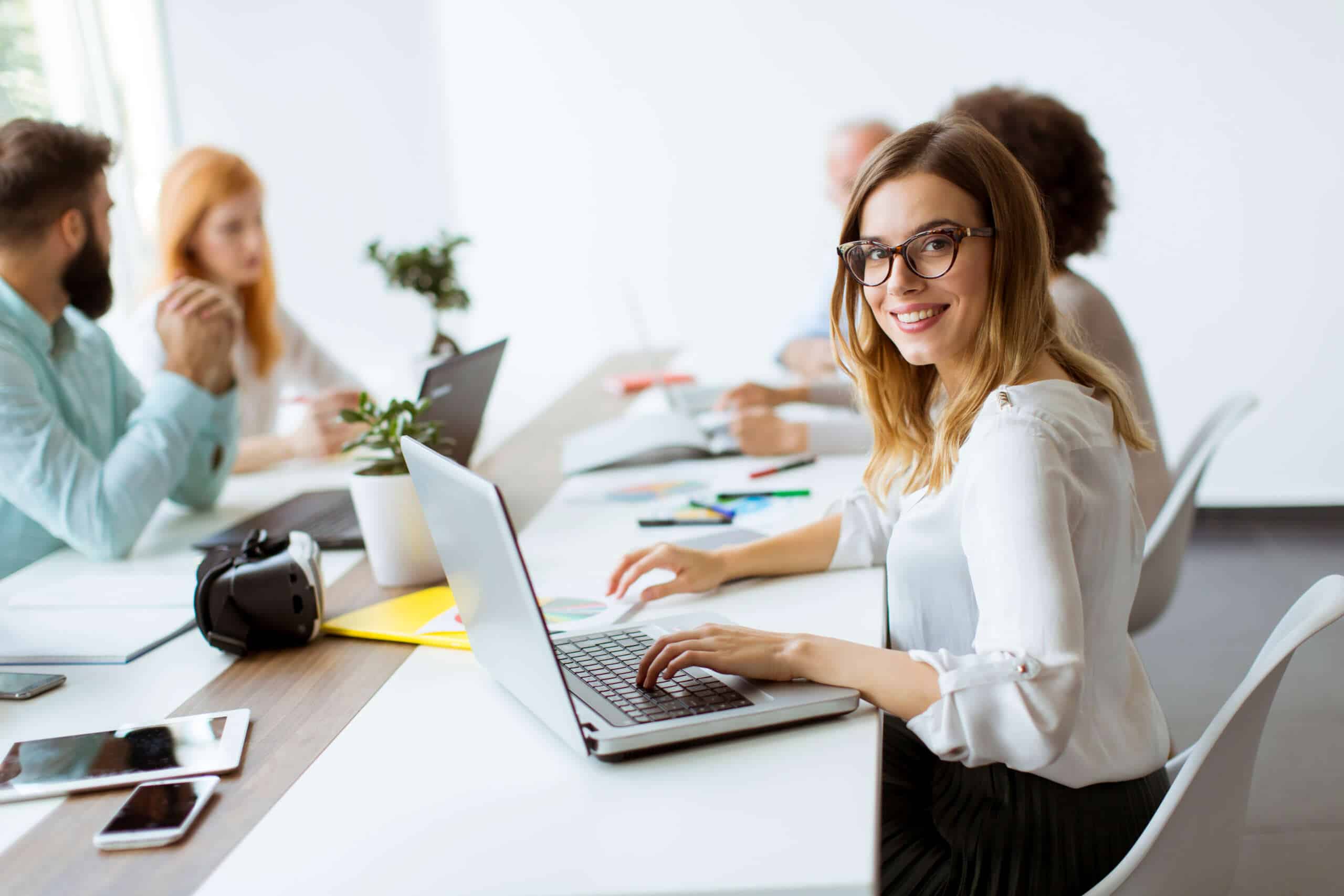 Employee smiling in a meeting