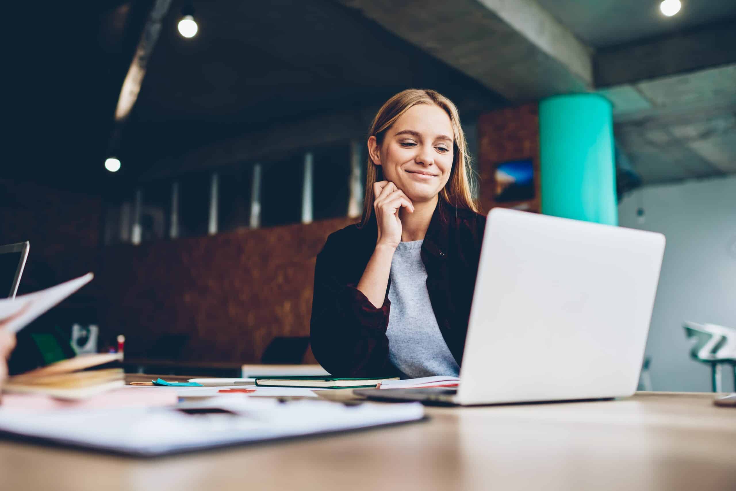 woman with laptop smiling