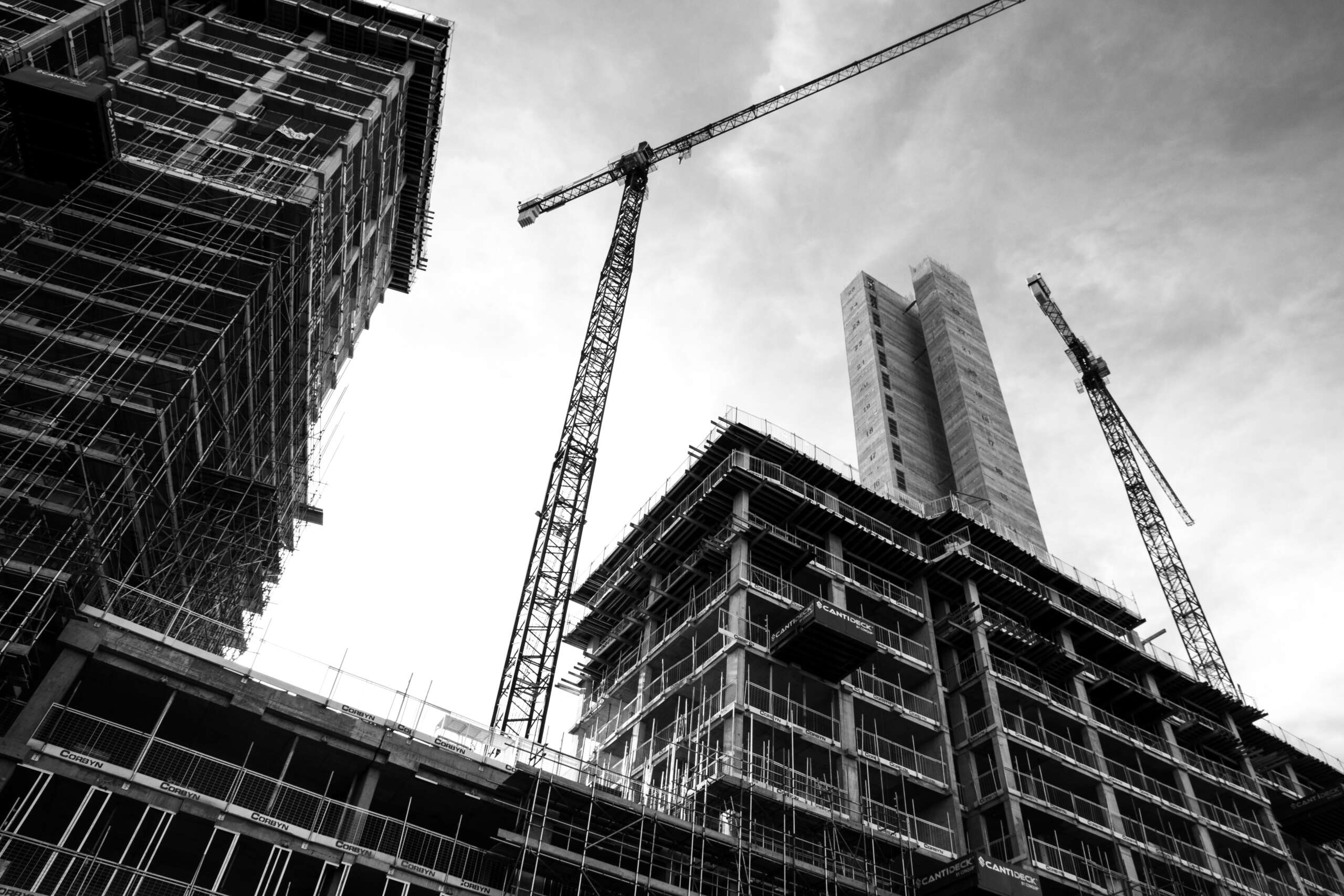 black and white photo of skyscrapers under construction