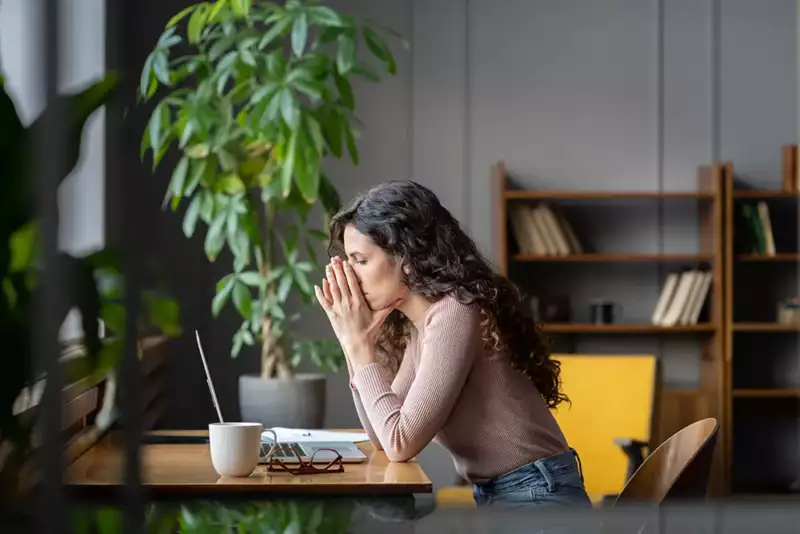 woman completing an exit survey on laptop