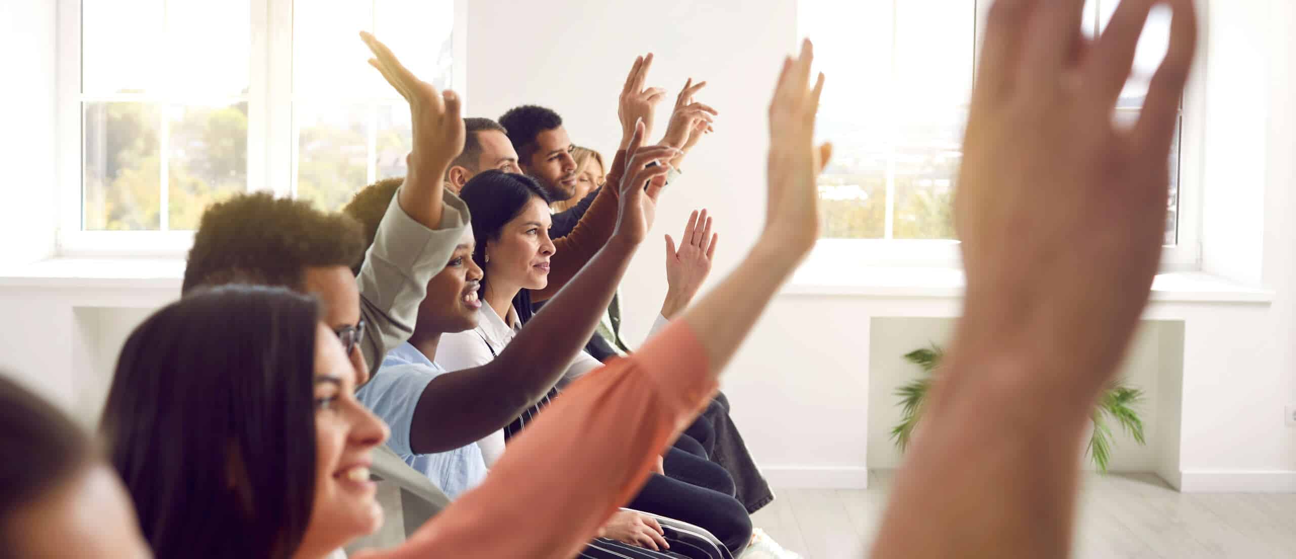 Employees listening and asking questions