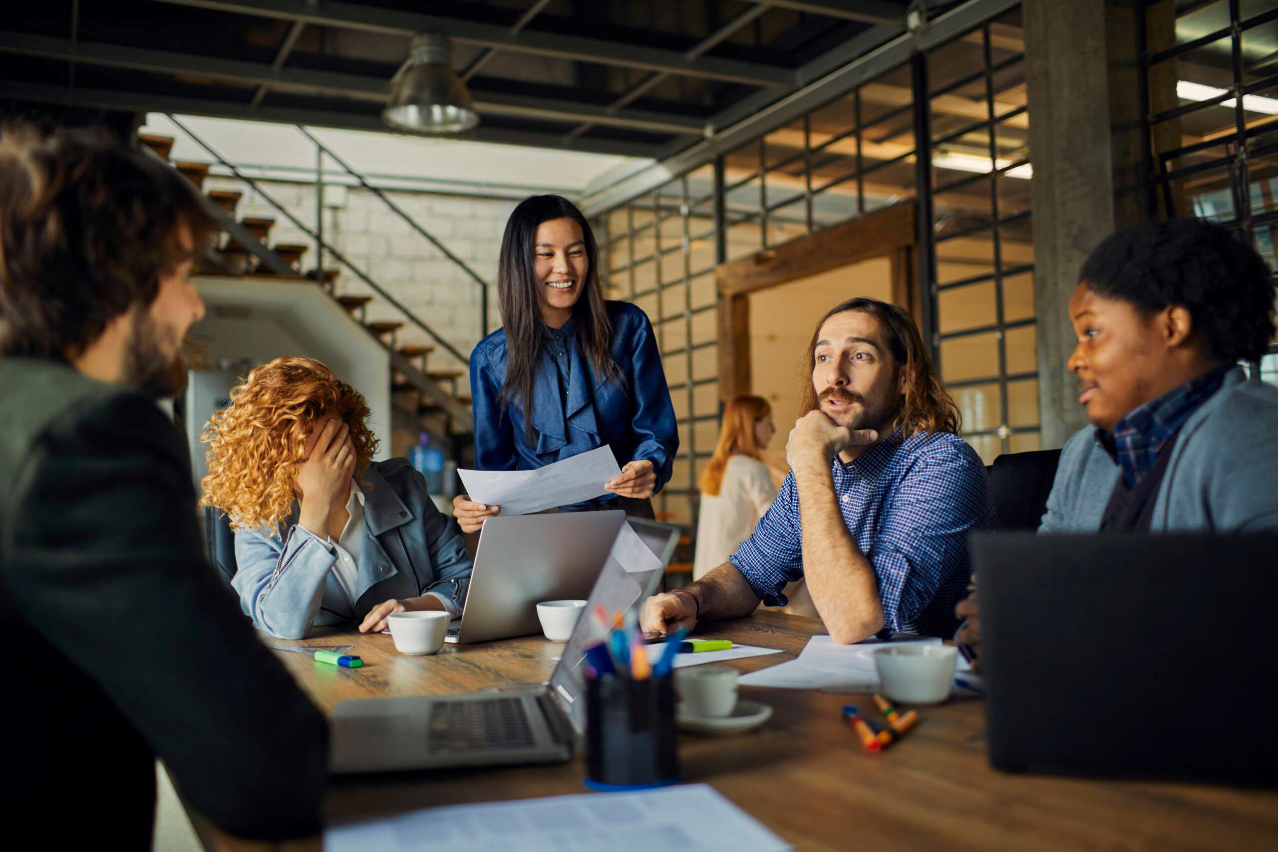 employees laughing and chatting together enjoying great work culture