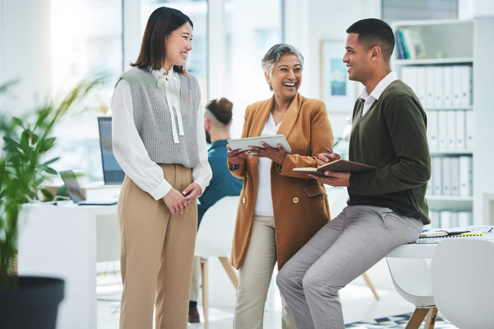 Employees happily discussing and providing feedback