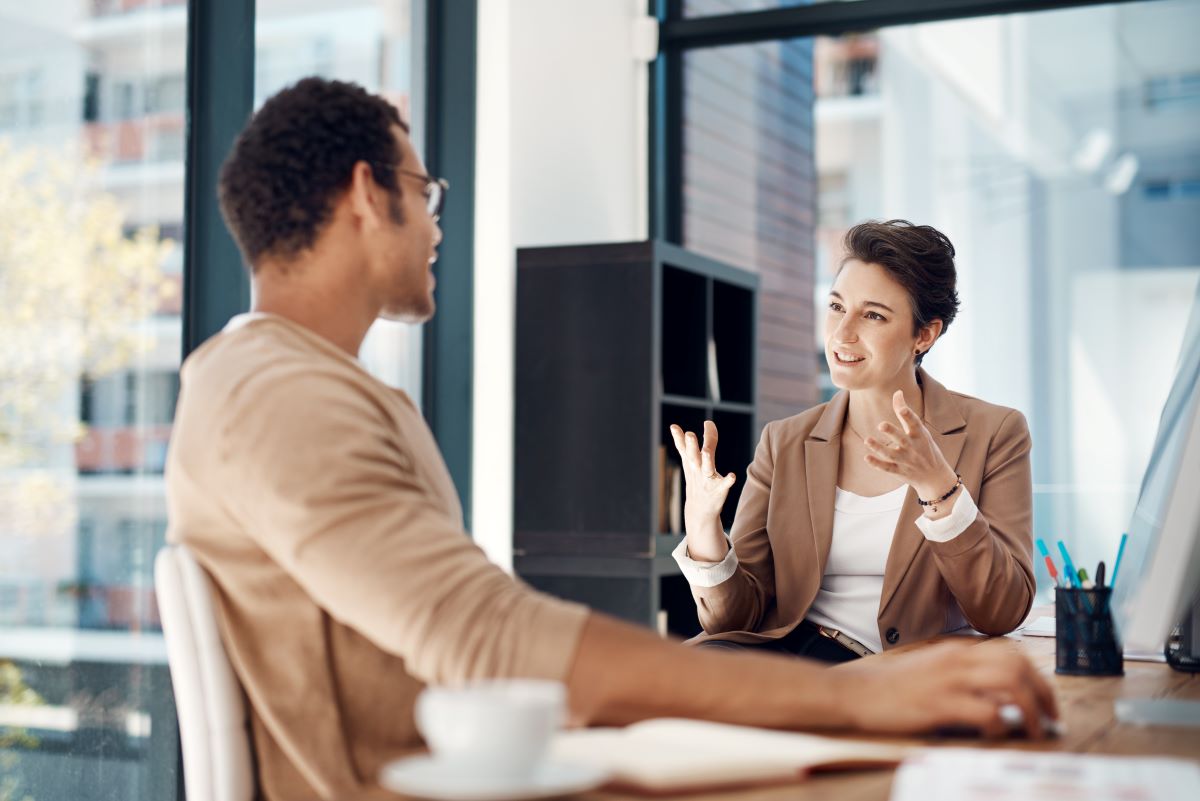 female leader mentoring a young employee