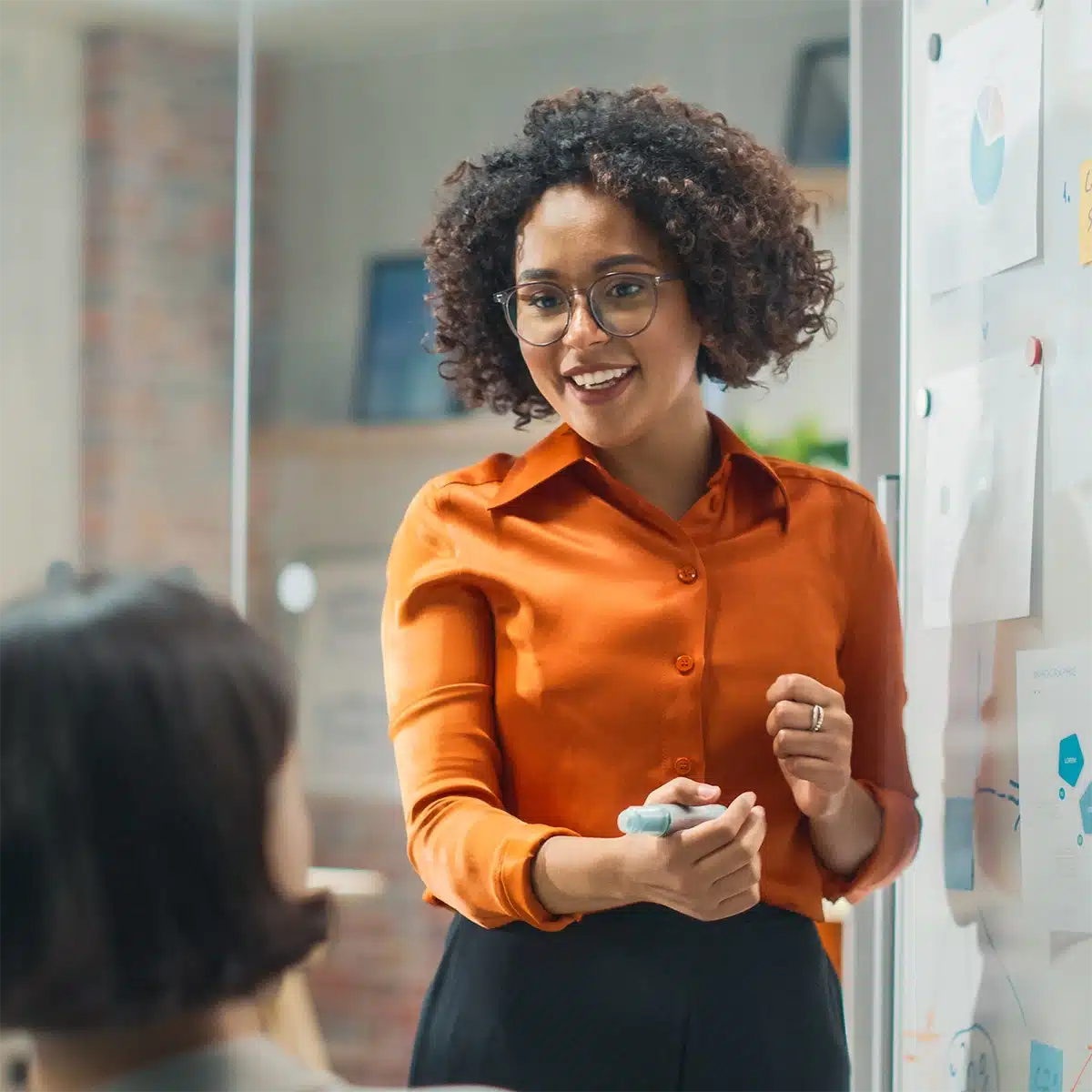 Business Woman Leading a Meeting – square webp